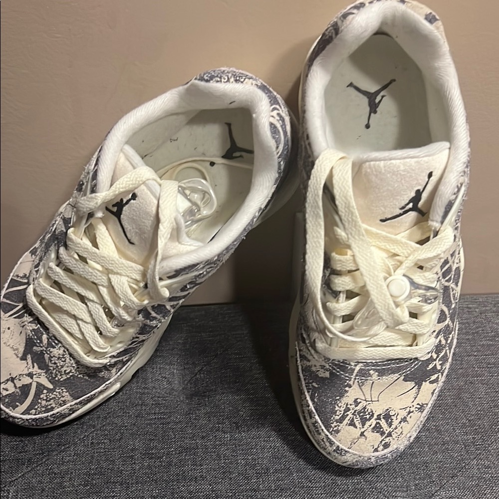 Jordan Black and White Athletic Shoes with Distinctive Design